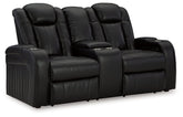 Caveman Den - Power Reclining Loveseat with Console/ Adj Hdrst - Midnight