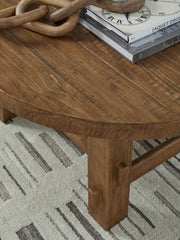 Mackifeld - Round Cocktail Table - Warm Brown